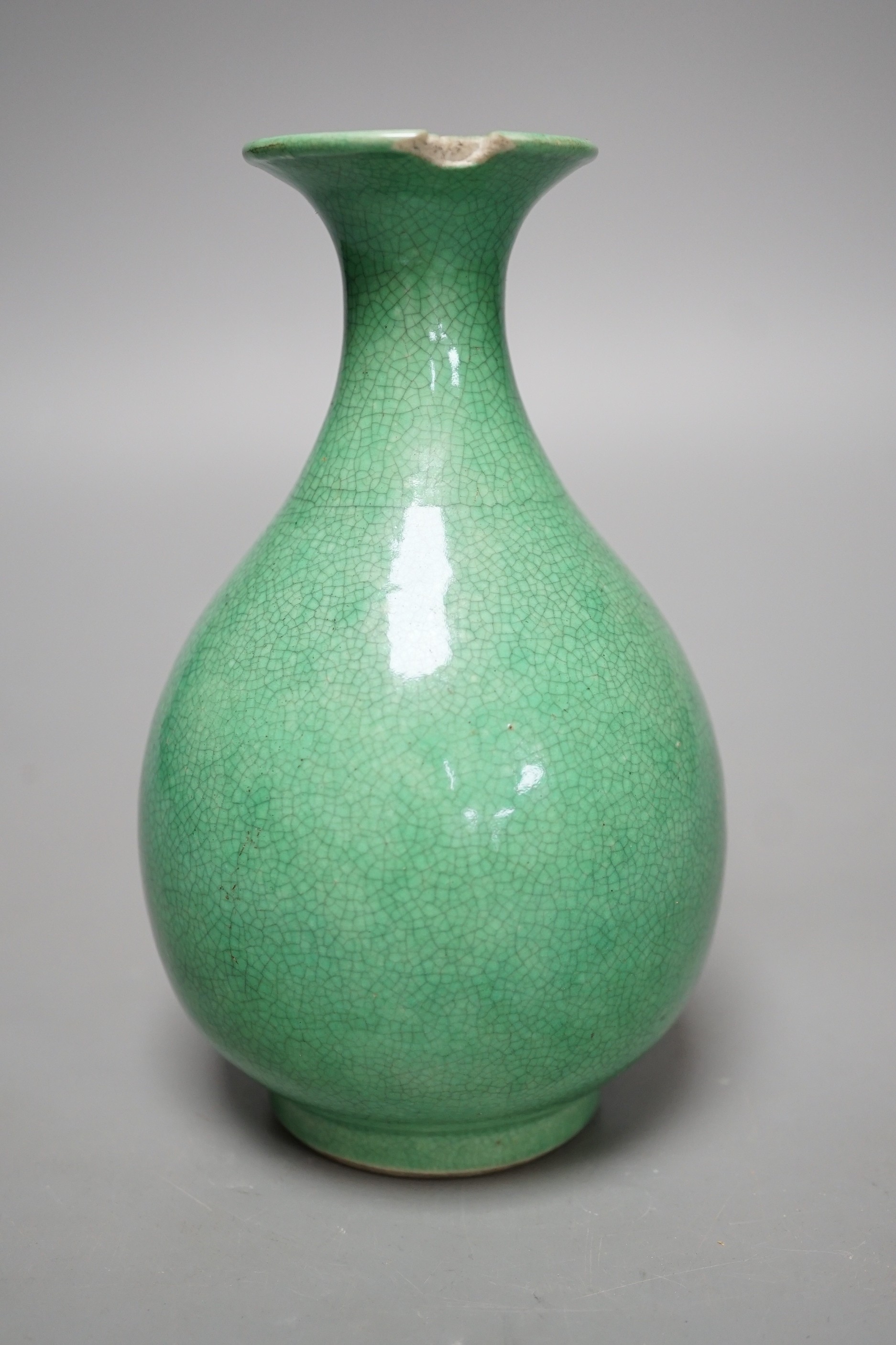 An early 20th century Chinese green crackle glazed vase (a.f.). 17cm.